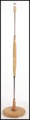 A 1970's retro teak wood standard lamp having terraced base with shaped teak wood bulbous upright