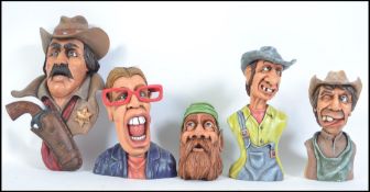 A collection of 4 impressive hand carved and crafted wooden figurines of American Sheriff Marshall,