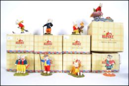 A collection of nine boxed Royal Doulton ceramic figures from the ' Rupert Collection ' to include