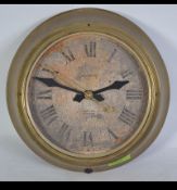A vintage early 20th century brass bulkhead factory Industrial clock marked for Magneta having