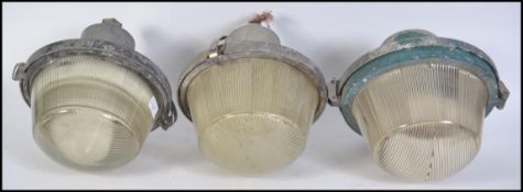 A pair of vintage 20th century Industrial GEC UFO type bulkhead lights with prism glass shades and