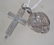 A white metal cross / crucifix engraved to one side with hearts and florals with he initials M and