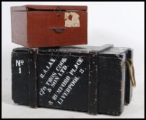 An early 20th century wooden steamer trunk with painted notation for RA Lax together with another