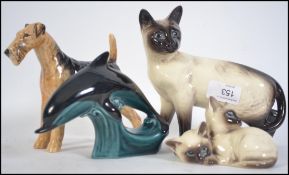 A collection of Beswick figurines to include a dog, large siamese cat,