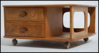 An original retro Ercol elm wood Golden Dawn Pandora coffee table with drawers and storage recesses