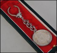 A silver King Faro uk of Egypt 20 Piastres Silver Coin dating to 1937 and being mounted upon a