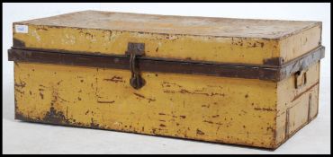 A vintage early to mid 20th century painted tin steamer / travel trunk of rectangular form with