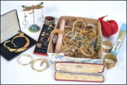 A large collection of costume jewellery to include rhinestone set bracelets and necklaces, rings,