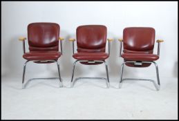A set of 3 late 20th century modernist cantilever chairs with chrome supports,