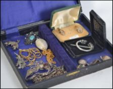 A small collection of costume and silver jewellery to include brooches, bracelets,