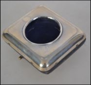 A silver hallmarked pocket watch easel back stand.