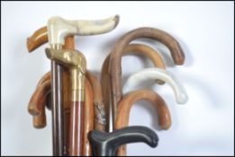 A collection of vintage waking sticks and canes various styles and sizes please see images.