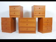 2 pairs of 20th century G-Plan teak wood bedside cabinet - chests of drawers each with knob handles