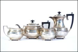 An Edwardian silver hallmarked 4 piece tea / coffee service, Comprising teapot,