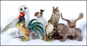 A good collection of animal and bird figures to include a to scale resin Jack Russell, Snowy Owl,
