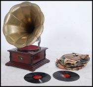 A 20th century HMV His Masters Voice gramaphone with wooden box base having a brass horn.