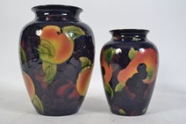 A pair of Moorcroft style tube lined vases by Royal Stanley from their Jacobean range.