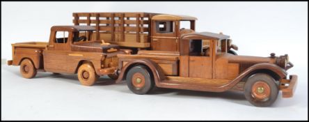 An impressive collection of 3 hand carved and crafted wooden American trucks / vehicles to include