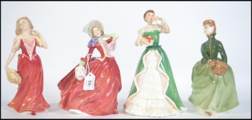 A collection of four Royal Doulton Bone China figures to include Autumn Breezes HN1834,