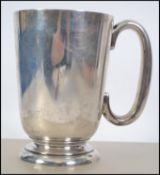A large silver hallmarked tankard by Walker & Hall dating to Sheffield 1936 Total weight 294.9g.