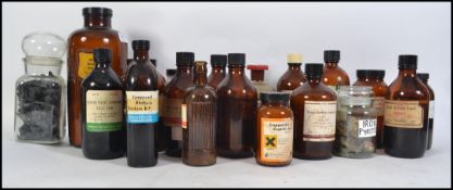 A large collection of vintage 20th century apothecary bottles many with original lables to the