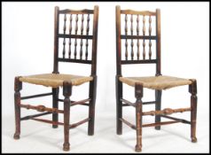 A pair of 19th century north country oak rattan weave dining chairs being raised on turned legs