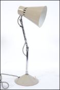 A 1950's articulated twin point swivel stem anglepoise desk lamp by Pifco.