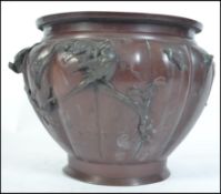 A late 19th century Japanese bronze planter decorated with swllos and fauna please see images.