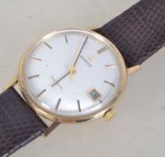 A vintage gentlemans 9ct gold Omega Geneve wristwatch.