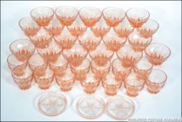 A good collection of vintage 20th century French peach glass sorbet dishes and glasses.