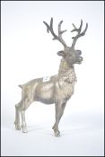 A good sized cast metal silvered figure a stag standing proud with six point antlers.