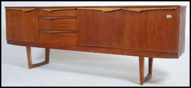 A 1970's Danish influence sideboard raised on angled legs with returns.