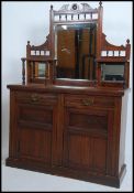 An Edwardian mahogany mirror back sideboard chiffonier having a plinth base with cupboards and 2
