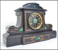 A Victorian black slate and malachite Marti & Co mantel clock having silver notation plaque to the