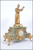 A 19th century French gilt marble clock having cylinder head movement with enamel dial raised on