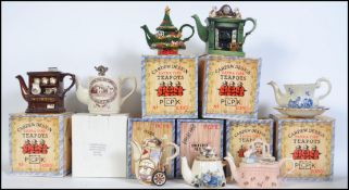A collection of eight boxed collectors novelty teapots by Paul Cardew.
