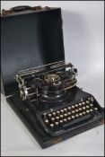 A 1930's vintage American Varityper typewriter complete in the original travel case.