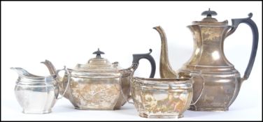 An Edwardian matching four piece silver coffee and tea service by George Harrison Brothers and