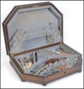 A vintage 20th century oak baize lined cutlery canteen with a selection of harlequin cutlery to the