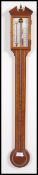 A 20th century inlaid mahogany pediment stick barometer by Comitti Holborn pediment above