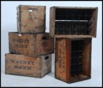 A stack of vintage mid century wooden advertising beer bottle crates,