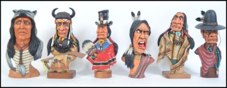 A collection of 6 impressive carved wooden figures of American Native Red Indians.