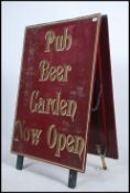A vintage 20th century wooden painted a-frame sign from a Bristol pub,