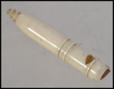 A 19th century carved bone whistle, probably Napoleonic prisoner of war work, measuring 4.
