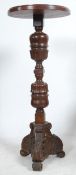 An unusual 19th century carved mahogany bust stand / plant stand having carved and turned column