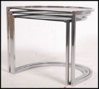 A 1970's retro chrome and smoked glass nest of tables.