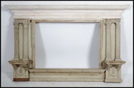 A very large 19th century painted architectural overmantel mirror surround.