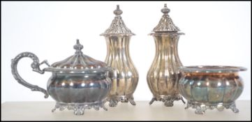 A early 20th century matching 4 piece silver condiments set by Henry Birks and Sons Canadian