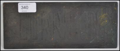 An late 19th early 20th century Art Nouveau name plaque reading CORRIGON with Art Nouveau