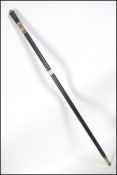 A 20th century Indian wood and bone inlaid accents sword-stick with brass bayonet lock and lion